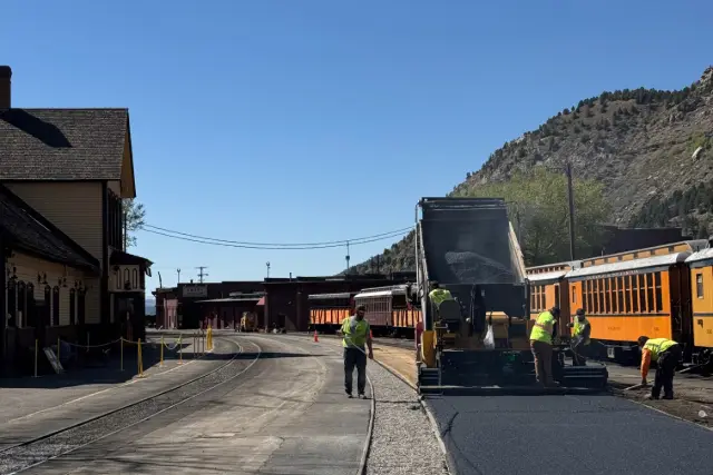 a group of people working on a road
