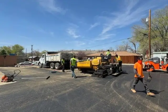 a group of men working on a road