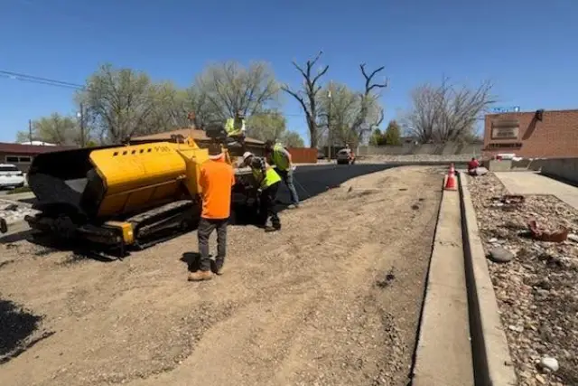 a group of men working on a road
