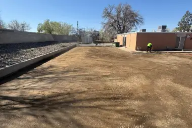 a construction site with a man standing on the ground